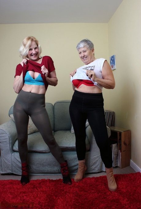 Old lesbians suck on each others boobs after modeling fully clothed