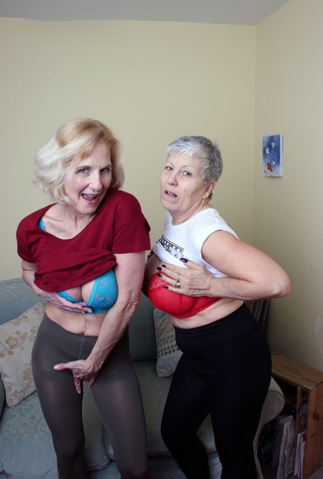Old lesbians suck on each others boobs after modeling fully clothed