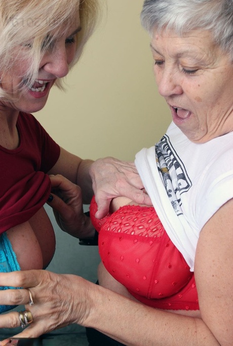 Old lesbians suck on each others boobs after modeling fully clothed