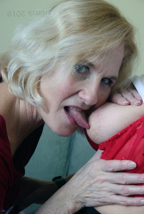 Old lesbians suck on each others boobs after modeling fully clothed