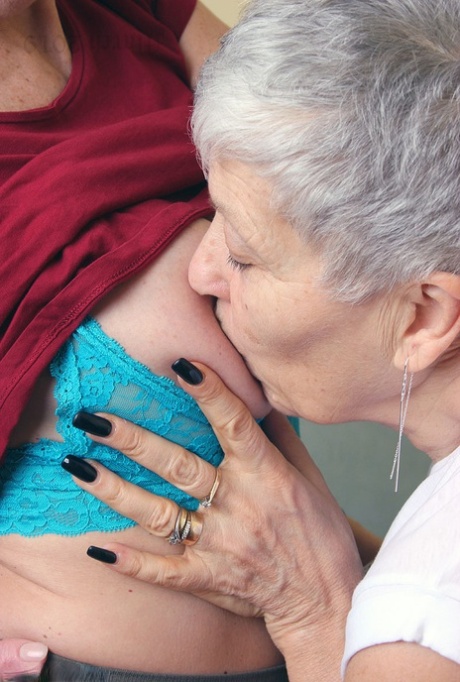 Old lesbians suck on each others boobs after modeling fully clothed