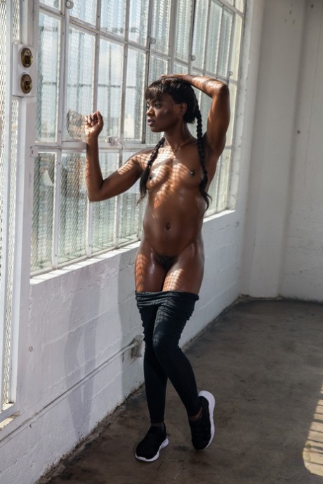 Hot black girl Ana Foxxx touts her phat ass during Playboy centerfold shoot