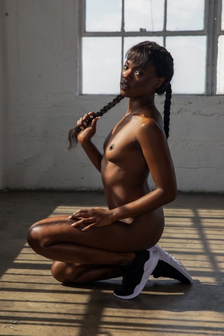 Hot black girl Ana Foxxx touts her phat ass during Playboy centerfold shoot