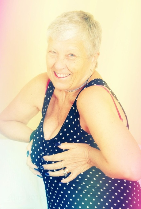 Sexy granny Savana flashes upskirt underwear before unleashing her large boobs