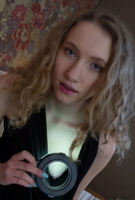 Blonde teen Ariel S spreads and fingers her nice pussy on a bed