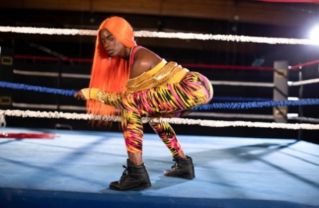 Black girl unveils her athletic body while in a boxing ring