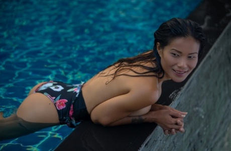 Asian model Maki Katana sports the wet look for a centerfold shoot