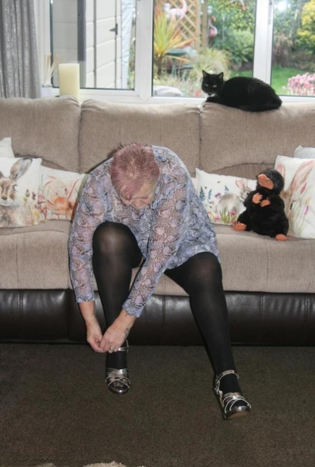 Old fatty Valgasmic Exposed exposes her huge ass in black stockings and heels