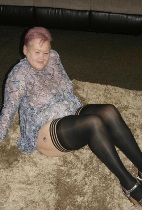 Old fatty Valgasmic Exposed exposes her huge ass in black stockings and heels