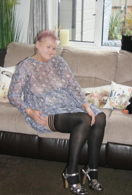 Old fatty Valgasmic Exposed exposes her huge ass in black stockings and heels