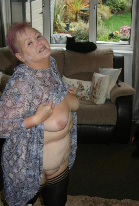 Fat nan Valgasmic Exposed casts off her dress to go naked in black stockings
