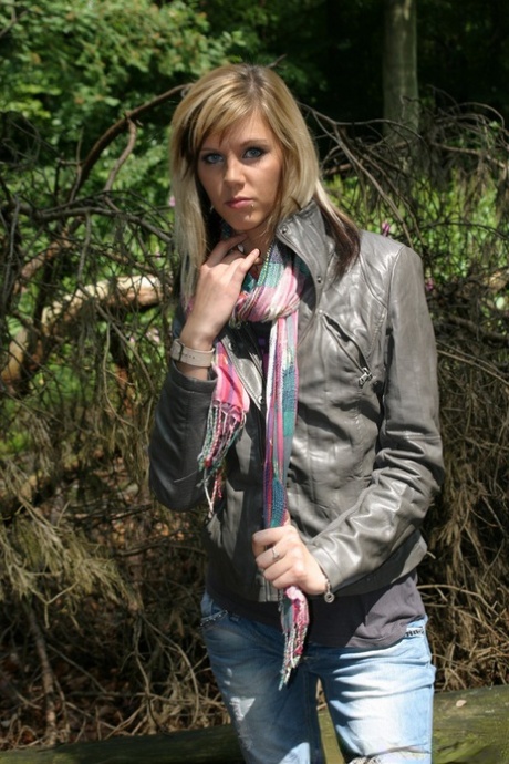 Anorexic blonde grabs her bare ass after disrobing in the woods