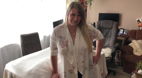 Middle-aged blonde Sweet Susi sports a creampie after sex with her masseur