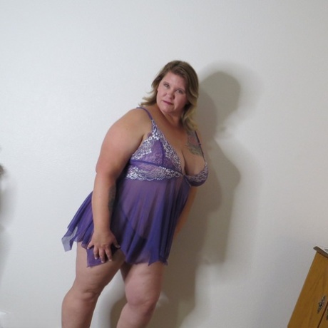 Fat amateur Busty Krisann doffs lingerie before standing naked against a wall