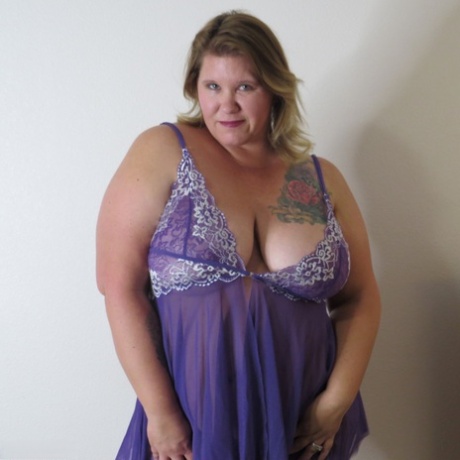 Fat amateur Busty Krisann doffs lingerie before standing naked against a wall