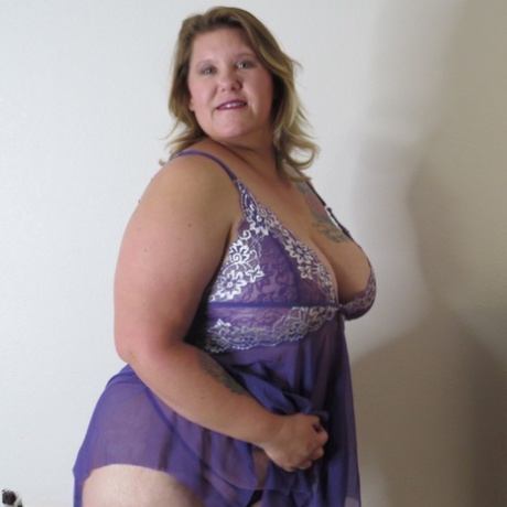 Fat amateur Busty Krisann doffs lingerie before standing naked against a wall