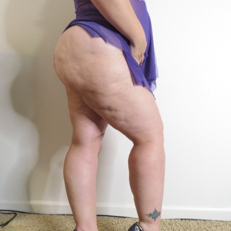 Fat amateur Busty Krisann doffs lingerie before standing naked against a wall