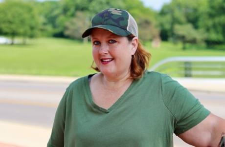 Obese amateur Goddess Pear models for a SFW shoot on an artillery gun in camo