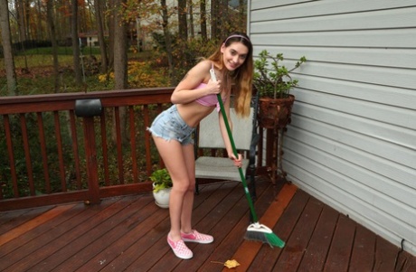 Petite girl Sera Ryder masturbates on a deck while sporting a tail butt plug