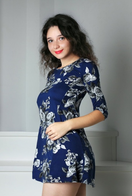 Beautiful brunette teen sports red lips while baring her great body