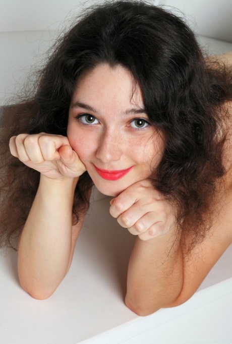 Beautiful brunette teen sports red lips while baring her great body