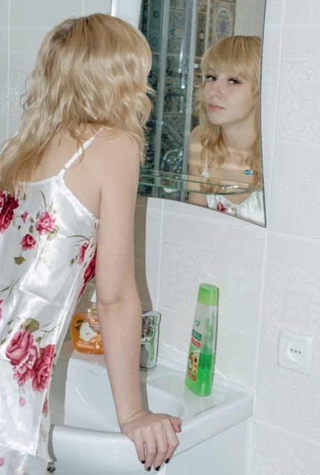 Blonde teen Sova gets caught totally naked while taking a shower