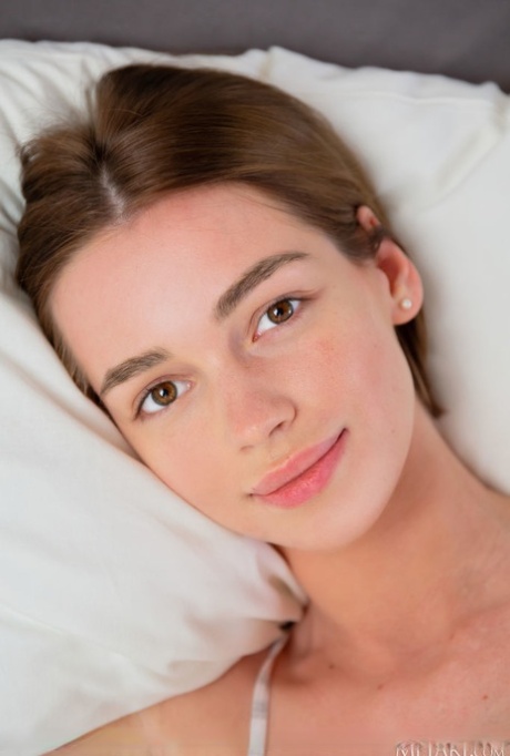 Beautiful young girl Amy Moloko gets completely naked in her bedroom