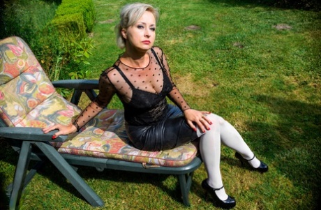 Old platinum blonde Nikita Wanilianna masturbates on a backyard lounge chair