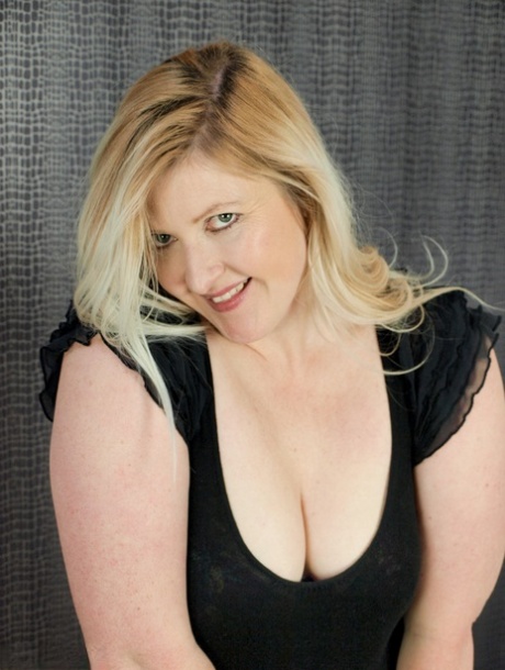 Overweight blonde Samantha gets naked on a chaise lounge in stockings