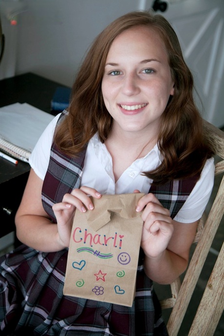 Schoolgirl Charli Maverick takes off her uniform during a solo performance