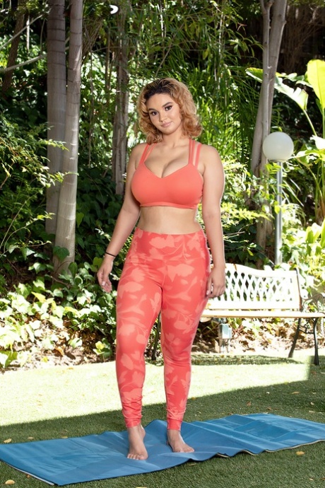 Latina chick Crystal Chase uncovers her big tits while going nude during yoga