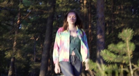 Pretty girl Vika Lita pulls down her jeans to pee amid saplings