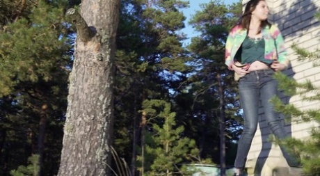 Pretty girl Vika Lita pulls down her jeans to pee amid saplings