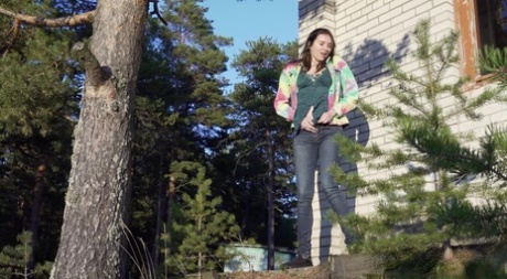 Pretty girl Vika Lita pulls down her jeans to pee amid saplings