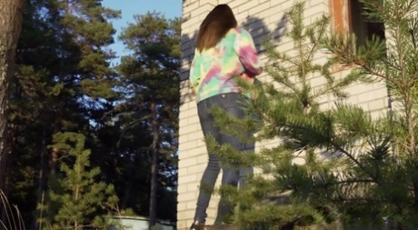 Pretty girl Vika Lita pulls down her jeans to pee amid saplings