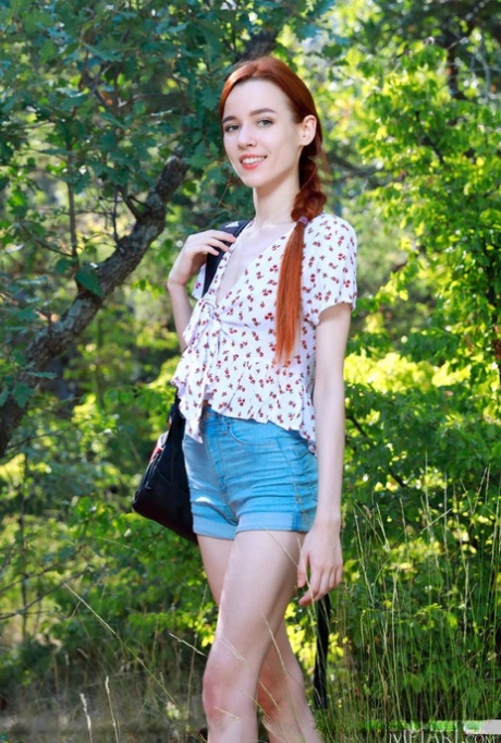 Young redhead Sherice gets totally naked inside her tent while camping