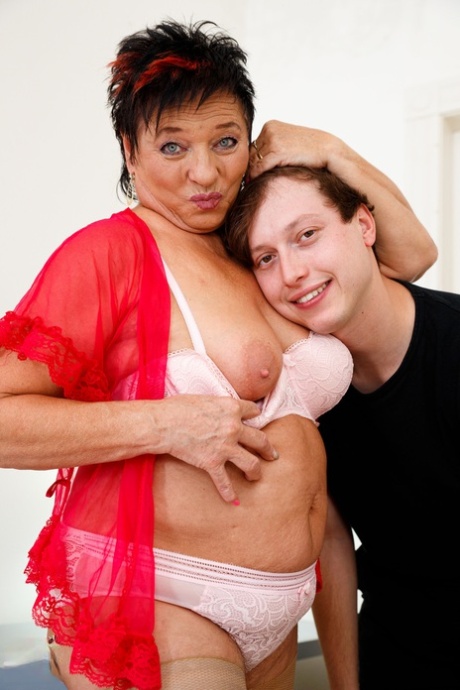 Overweight granny Joanne has sex with her far younger lover atop a bed
