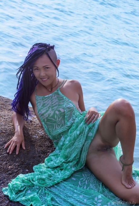 Asian teen Sweet Julie emerges from the ocean to go bare naked
