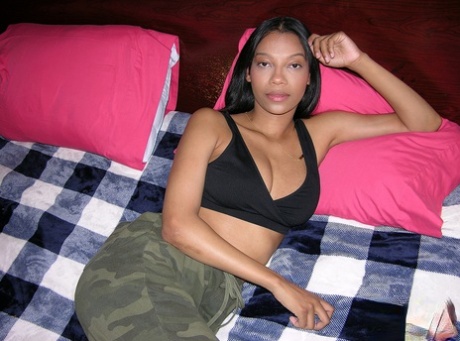 Pretty black girl Eden West makes her nude modelling debut on a bed