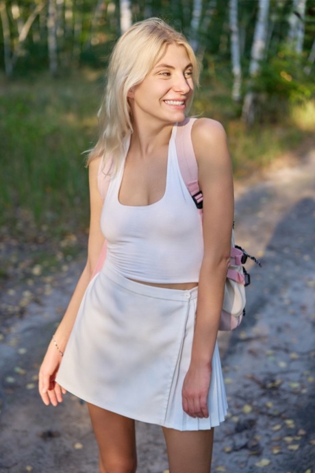Sweet blonde teen Paulina gets naked while in a stand of birch trees