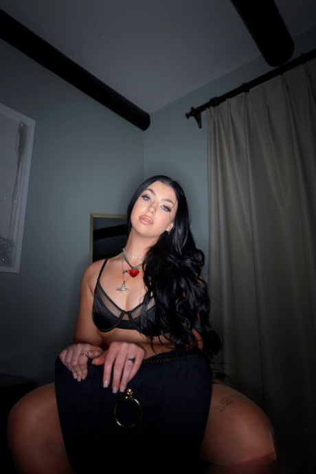 Dark haired MILF Holly Day rocks her booty while greeting her man friend