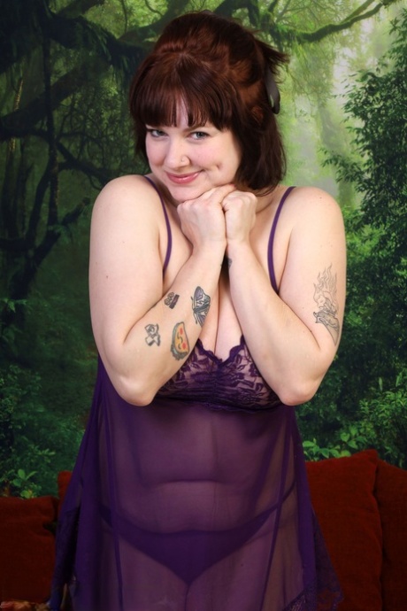 Over 30 plumper Satine removes purple lingerie prior to masturbating
