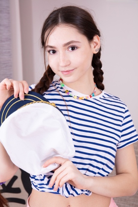 Adorable teen Fendi sports a captain's hat while getting naked in pigtails