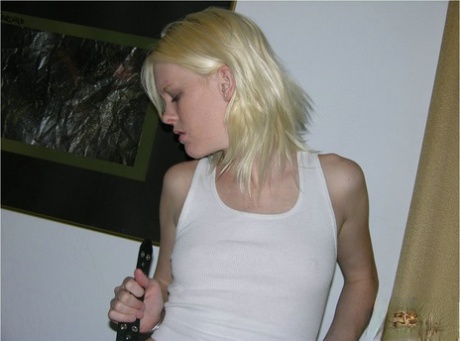 Blonde amateur in shit kicker boots tales of hr clothes to pose nude on sofa