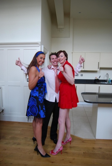 Tall women take part in a threesome while garbed in garters and nylons
