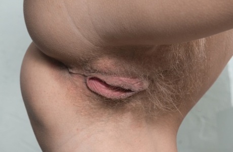 Sexy amateur Ayda spreads her legs for close up views of her hairy pussy