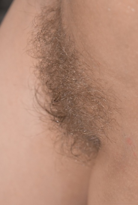 Sexy amateur Ayda spreads her legs for close up views of her hairy pussy