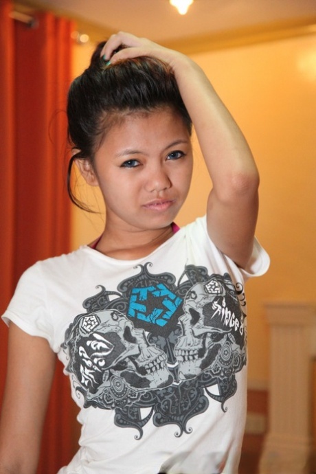 Petite Filipina teen Altea gets naked atop a bed for her sugar daddy