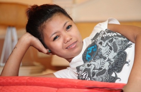 Petite Filipina teen Altea gets naked atop a bed for her sugar daddy