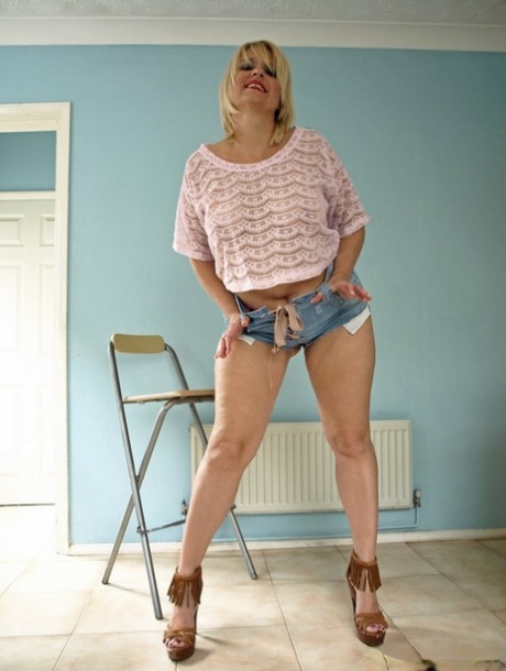 Thick older blonde Daniella English sliding cutoff shorts over big ass